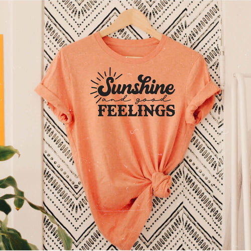 Sunshine And Good Feelings retro tee in sunset orange with black lettering